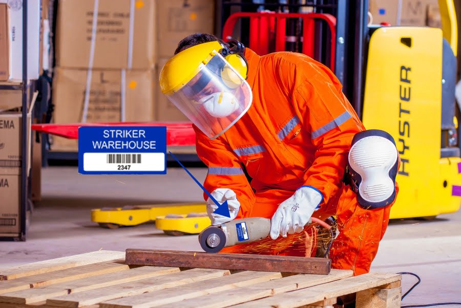 Tool tracking labels Tool Tracking Labels. Warehouse worker using tool with label on it